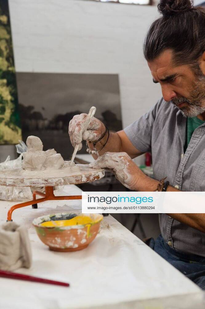 Attentive Senior Man Molding Clay Stock Photo - Image of paint, occupation:  99904544