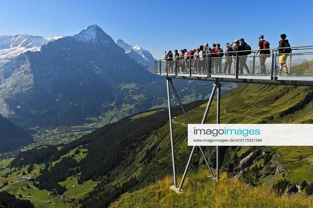 Tourists on the lookout platform high above Grindelwald in the