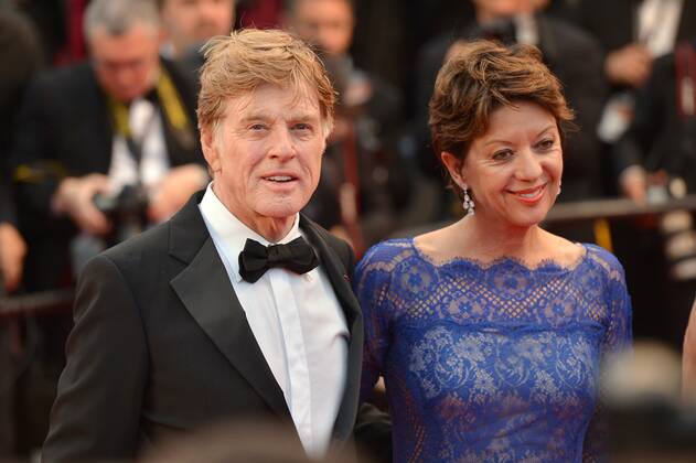 Robert Redford and his wife Sibylle Szaggars pose on the red carpet by the  Premiere All Is Lost by