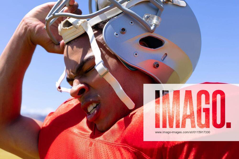 football-player-with-helmet-side-view-close-up-of-a-mixed-race-male