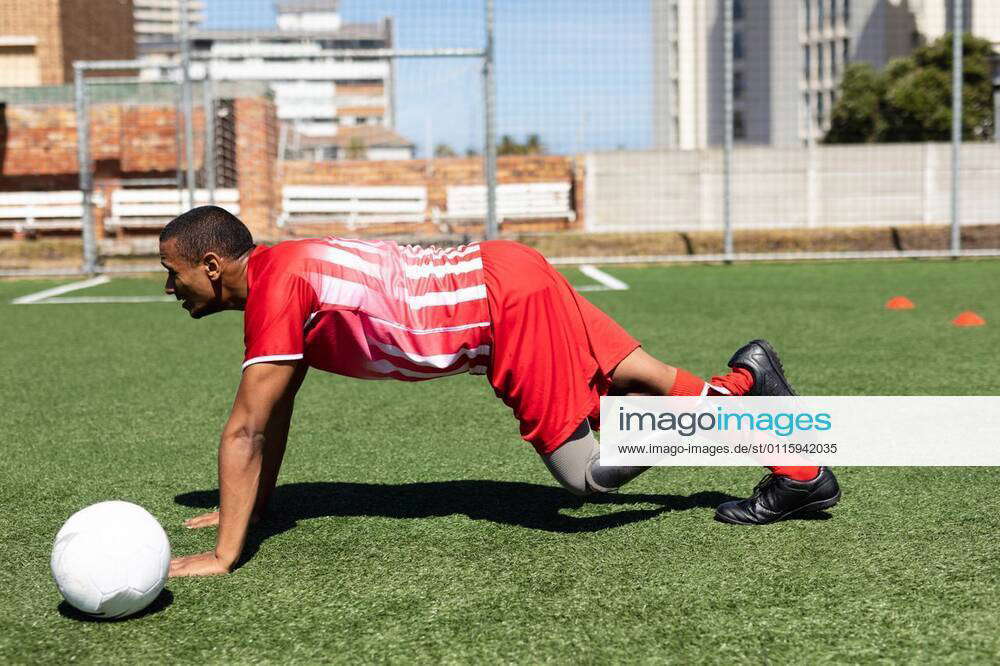Mixed race male football player with prosthetic leg at a sports field