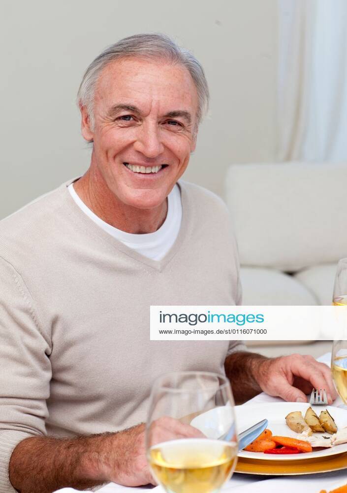 Senior man eating turkey in Christmas dinner Senior man eating turkey ...