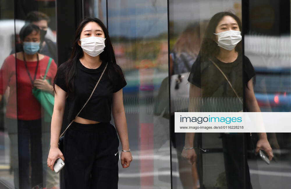 QLD CORONAVIRUS COVID19, A women wearing a protective face mask is seen