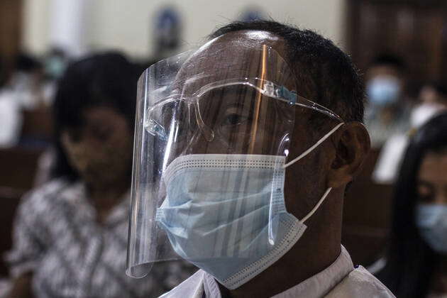 April 1, 2021, SLEMAN, YOGYAKARTA, INDONESIA: Catholics use masks and ...