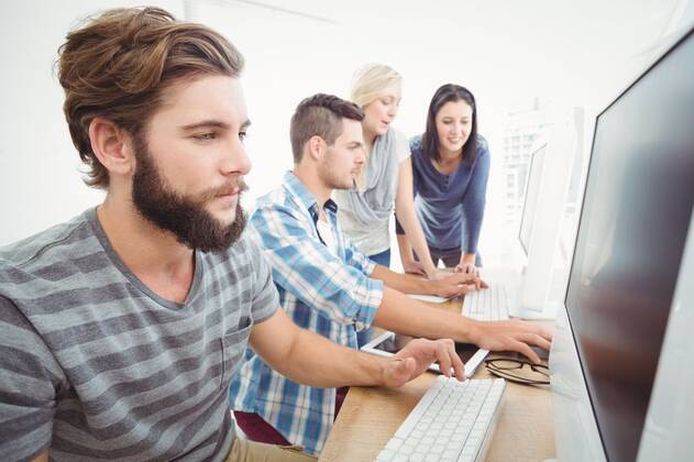 Computer Team Business team working at a computer Business team working at a computer ...