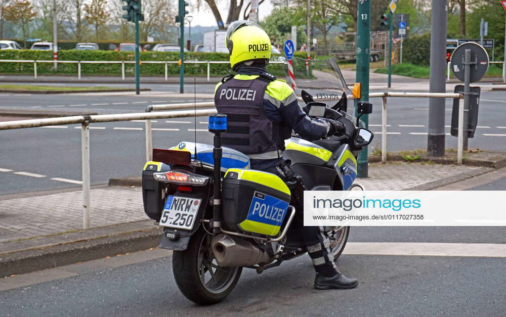 Control in times of crisis Police patrol on a motorcycle in Essen ...