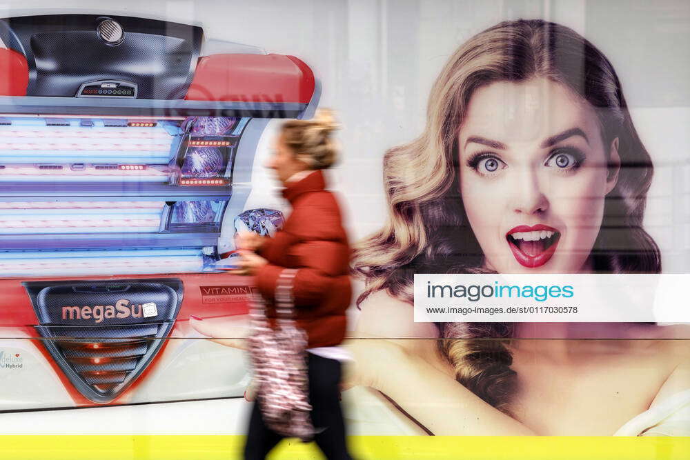 A sunbleached advertisement for a new tanning bed on a tanning salon