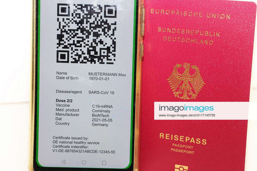Symbolic passport and a digital green passport as proof of vaccination