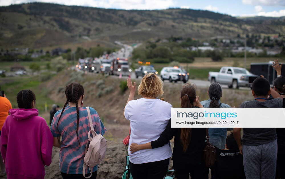 June 5, 2021, Kamloops, BC, Canada: People watch and wave as a convoy ...