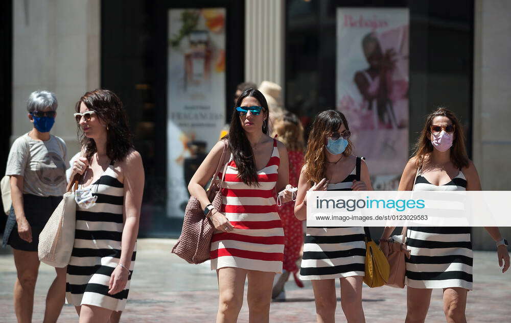 June 26, 2021, Malaga, Spain A group of women wearing face masks and