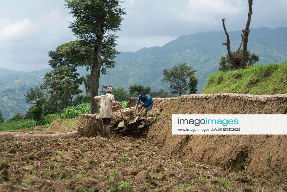 June 29, 2021, Kathmandu, Nepal Nepalese farmers move a plow to the