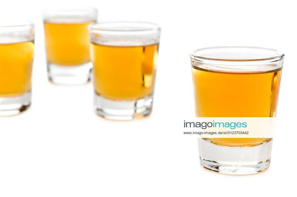 Shot glasses of whiskey