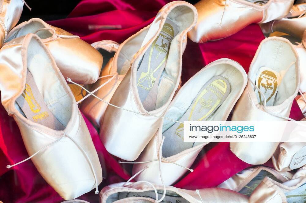 Pink ballet pointe shoes London, England. xagefotostockx xStefanoxRaverax