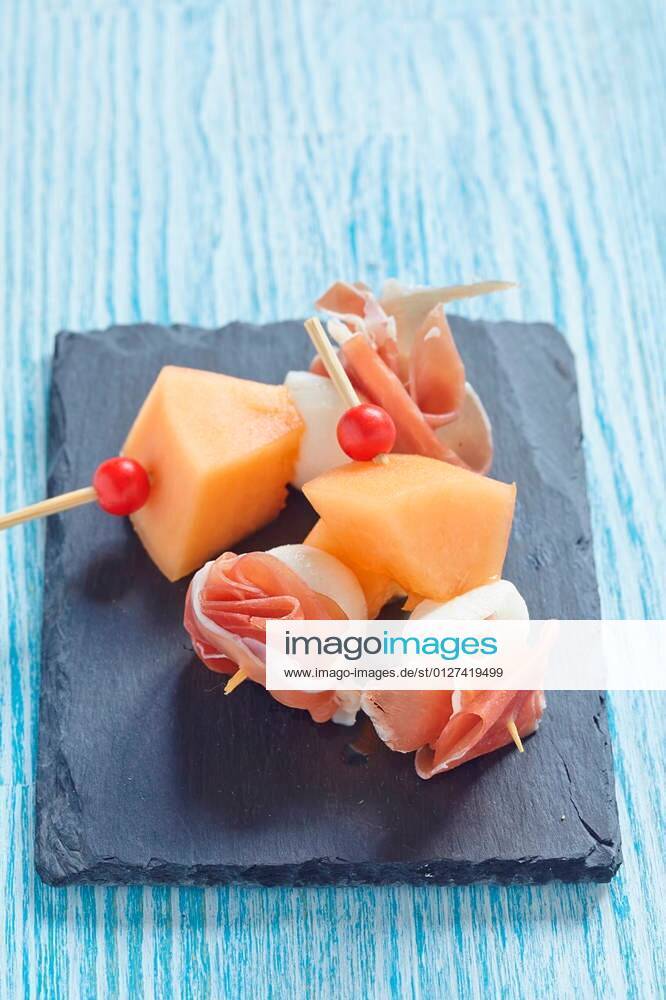 Appetizer canape with melon, cheese ball and prosciutto xFotosearchxLBRFx xAzuritax