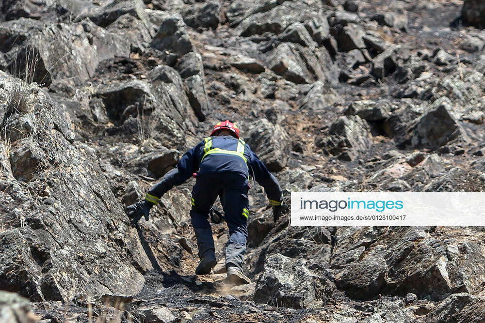 A firefighter climbs a slope during the extinguishing work of the San ...