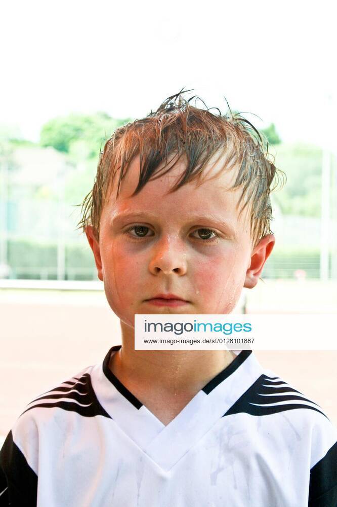 Boy exhausted from playing football model released, Symbolfoto