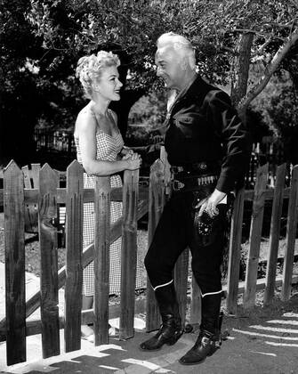 William Boyd (right), in his HOPALONG CASSIDY costume, with his wife ...