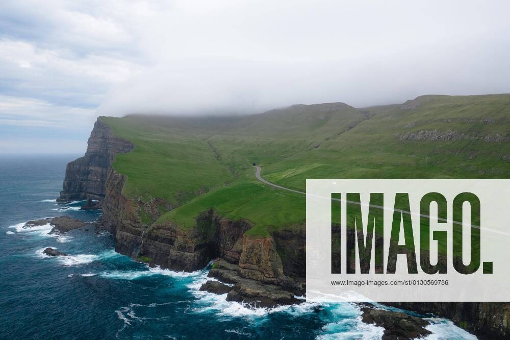 Aerial view, Sumba cliff with road and tunnel, Sumba, Suduroy, Faroe ...