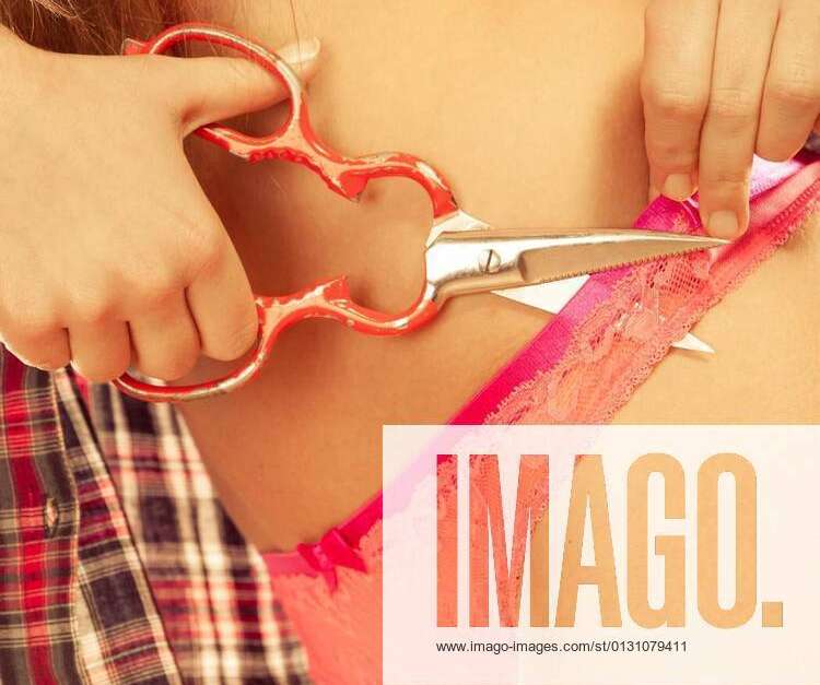 Girl taking off panties, cutting her lingerie - Stock Photo [20710833] -  PIXTA