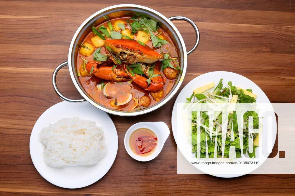 Prepared hot pot of crabs and seafood with lettuce, vermicelli and fish