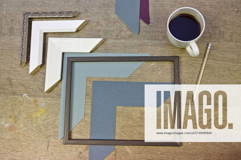 Still life of frames and coffee in picture framers