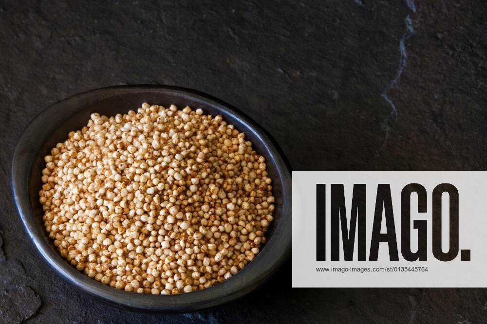 Puffed quinoa seeds (Chenopodium quinoa) in a traditional black clay dish
