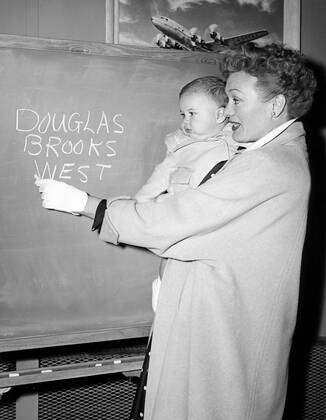 Eve Arden, star of OUR MISS BROOKS, gives a writing lesson to one-year ...