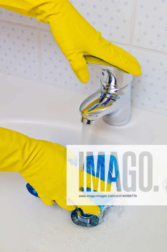 Cleaning the sink of a bathroom, woman wearing latex gloves, McPBBO