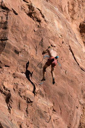 A sport climber on lead falls off the wall called the Theater near Moab ...