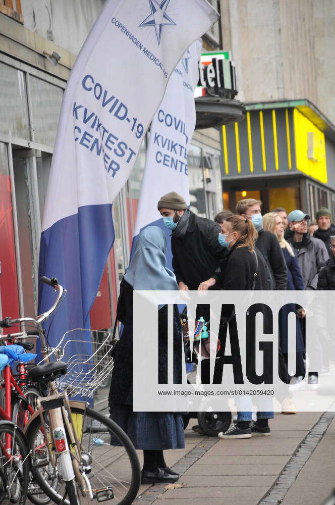 Kastrup Copenhagen Denmark. 17 November 2021 People standig in n long line for Quick corona test in