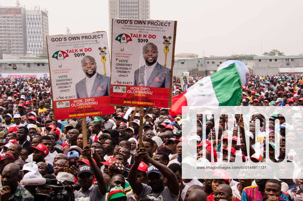 Supporters of PDP (People Democratic Party) wave party flags and ...