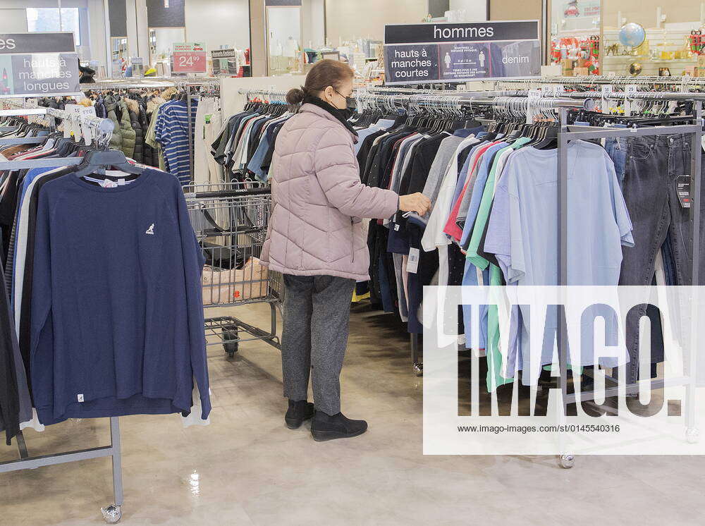 December 19, 2021, Montreal, PQ, Canada A woman browses at a clothing