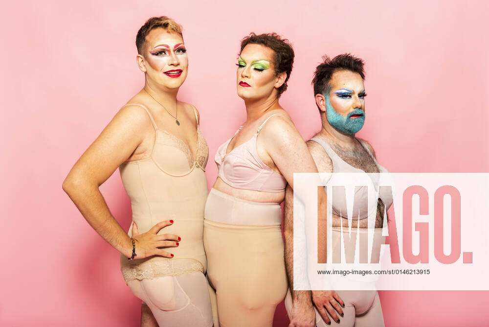 Drag queens in shapewear by pink background model released