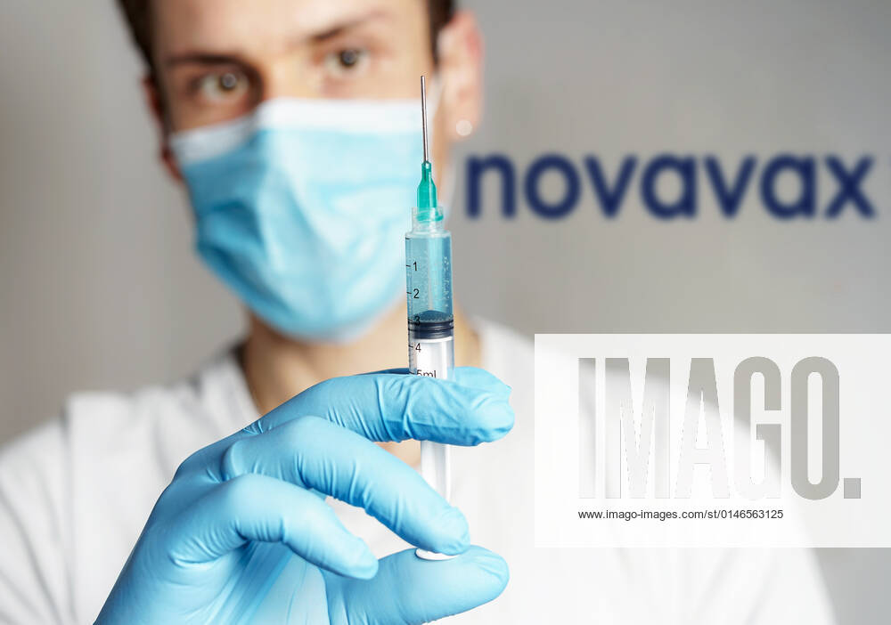 Novax Injection : Doctor holds syringe containing NOVAVAX NVX CoV2373 vaccine against covid