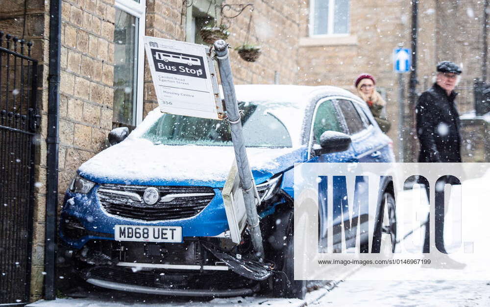 a-car-crashes-in-to-a-bus-stop-after-skidding-on-a-steep-street-in