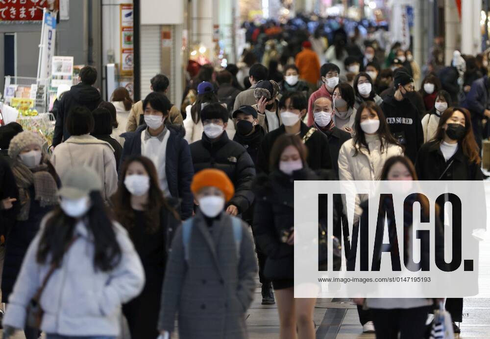 Surge in COVID19 cases in Japan People wearing masks for protection against the coronavirus walk