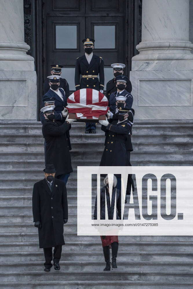 A military honor guard carries the casket of former Senate Majority ...