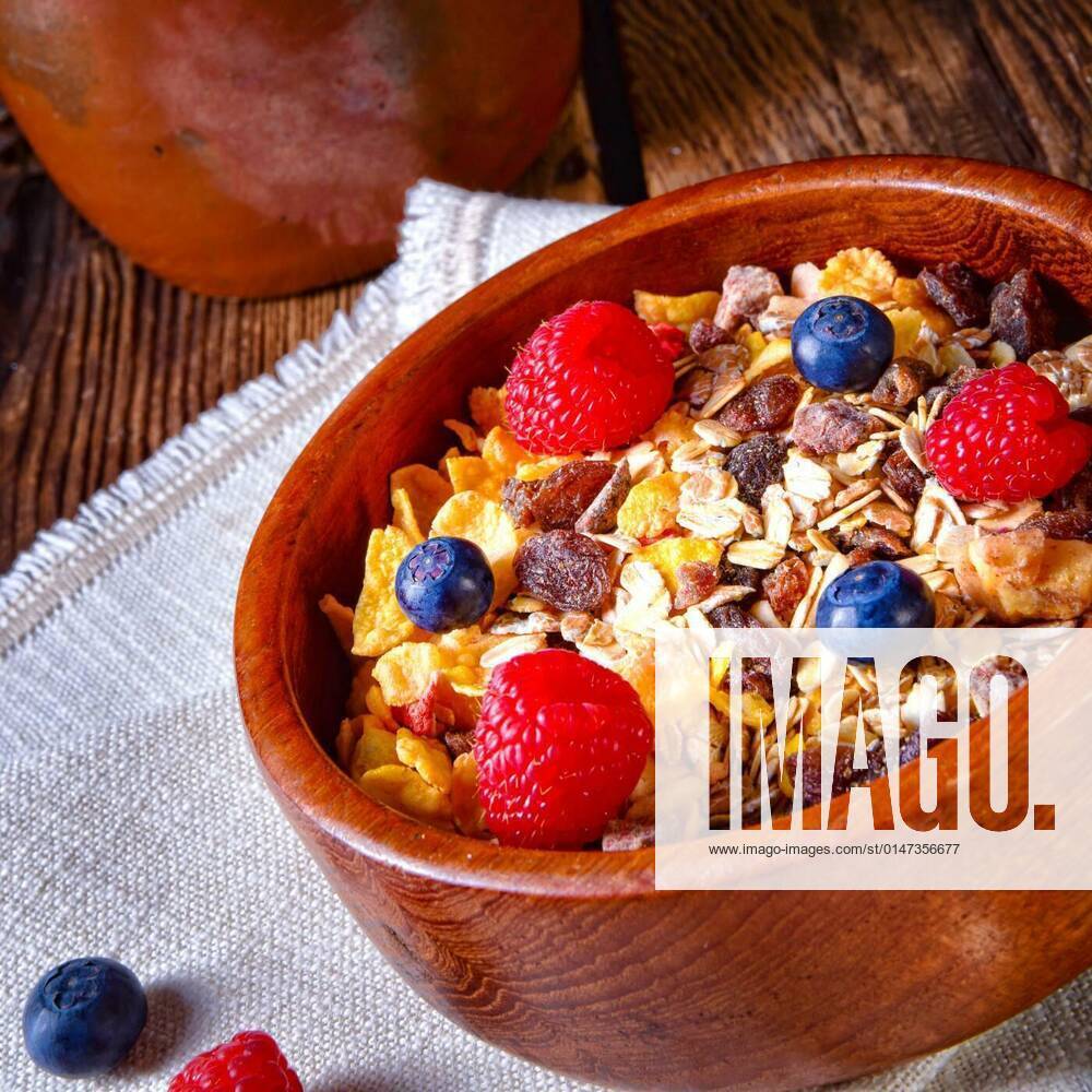 Rustic muesli breakfast with forest fruits