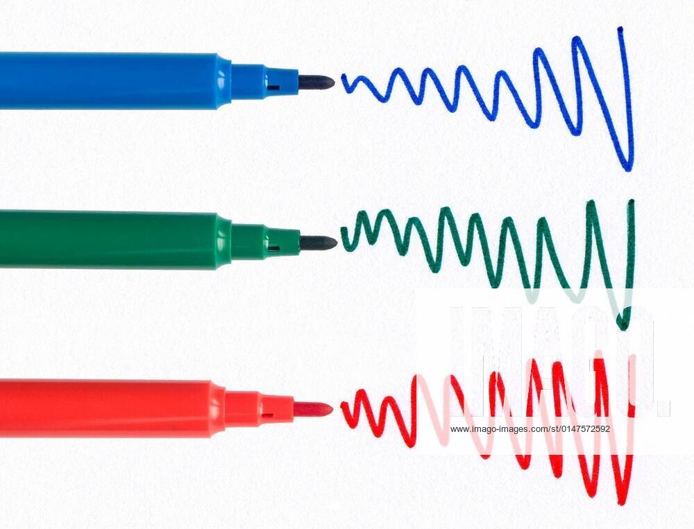 Red green and blue felt tip pen squiggles on white paper Stock