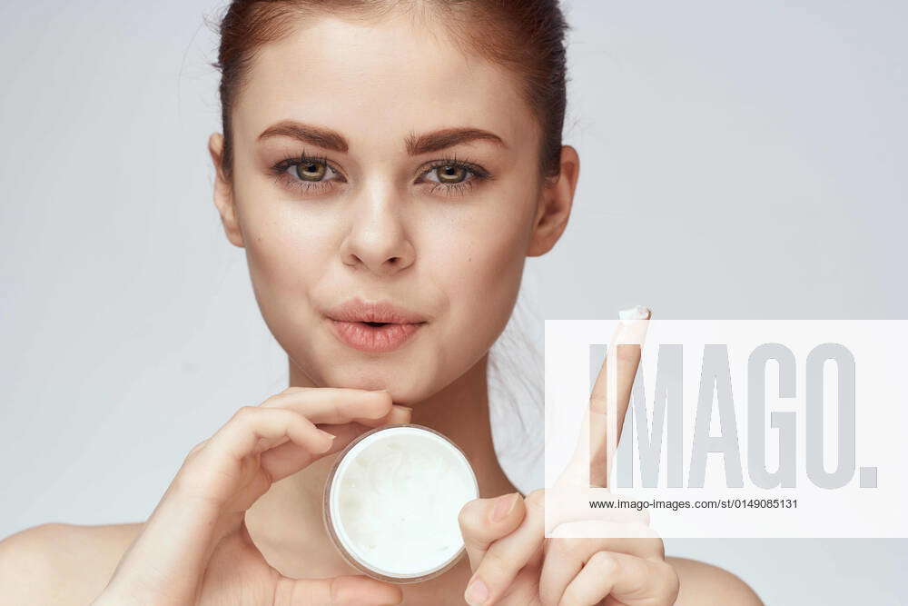 Woman with jar of cream makeup face skin care closeup woman with jar
