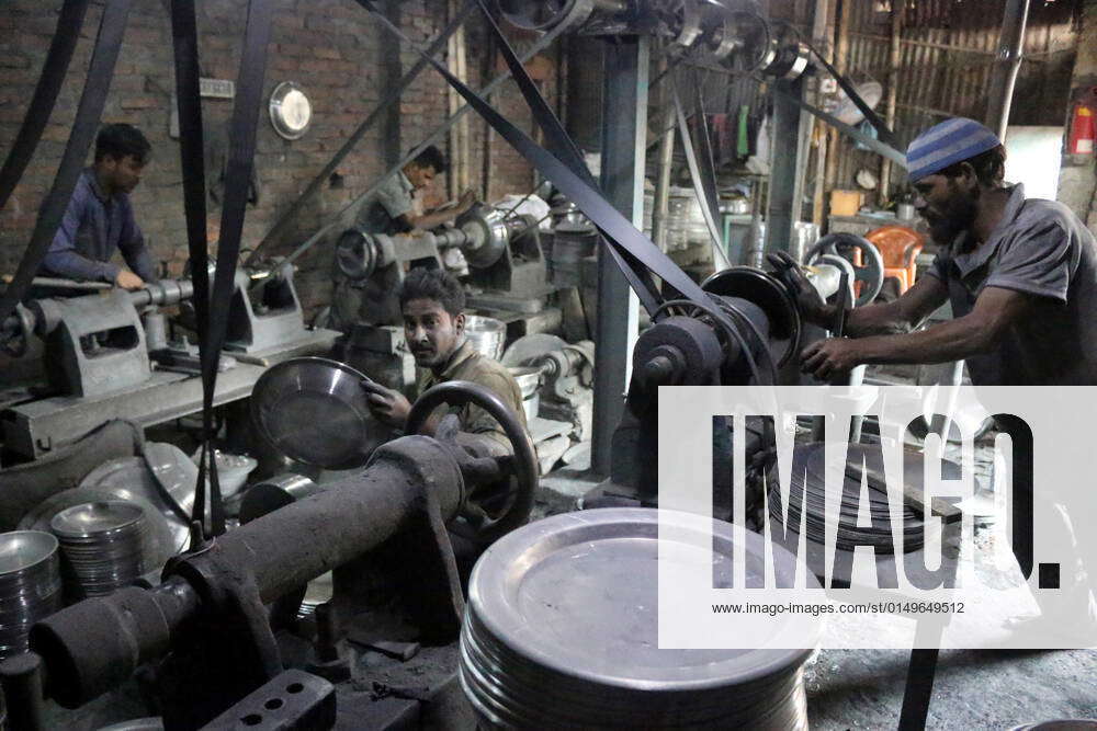 February 2, 2022, Dhaka, Bangladesh Workers make utensils at an aluminum factory in Dhaka. Dhaka s