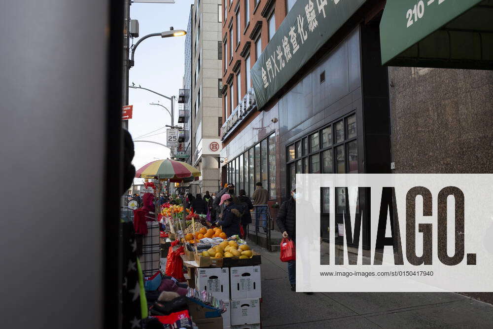 February 10, 2022, New York, New York, USA Wearing masks in Chinatown