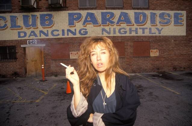 Female smoking in night club parking lot, Los Angeles, California ...