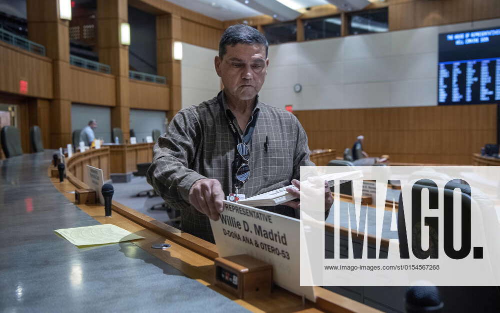 April 4, 2022, USA Deputy Sergeant at Arms Greg Gonzales puts name plates on desks on the house