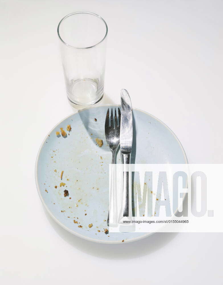 Crumbs and Silverware on Plate