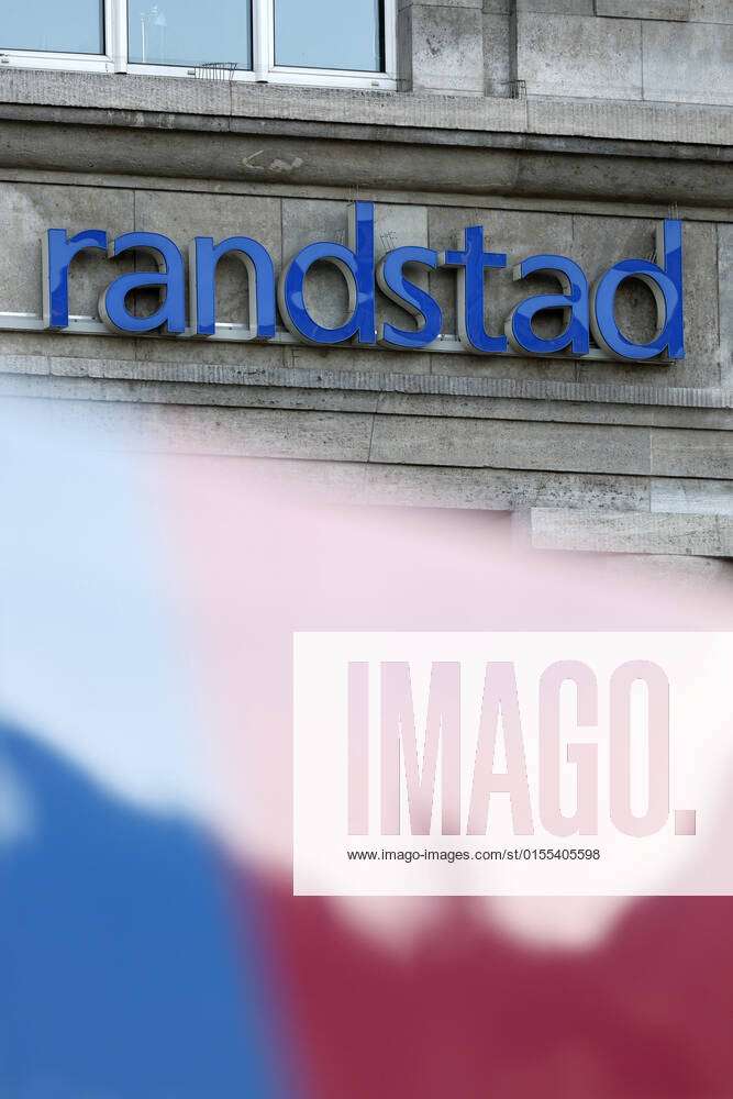 Advertisement billboard displaying logo of Randstad Stock Photo | Adobe  Stock