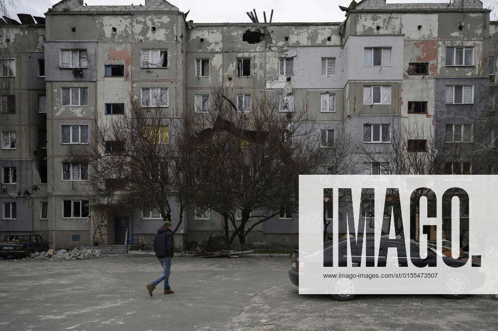 April 12, 2022, Makariv, Kyiv, Ukraine: A man seen walking in a damaged ...