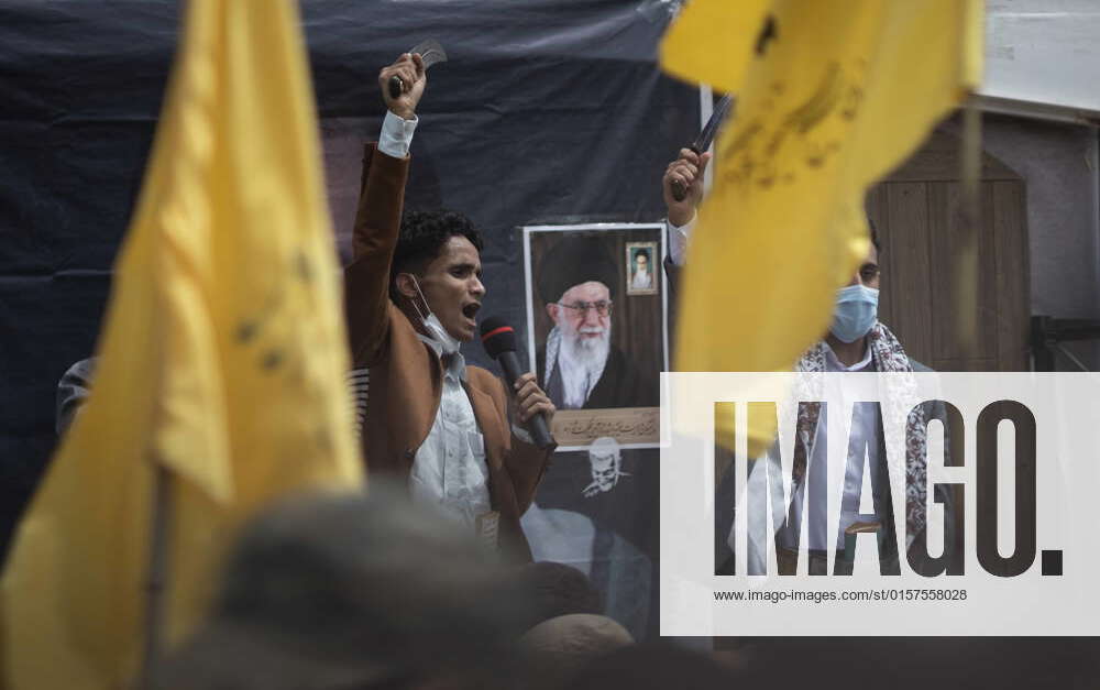 Jerusalem Day In Tehran A Yemeni Houthi holds-up a bowie knife as he ...