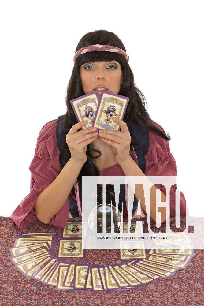 Fortune teller with crystal ball lays the cards, tarot cards fortune ...