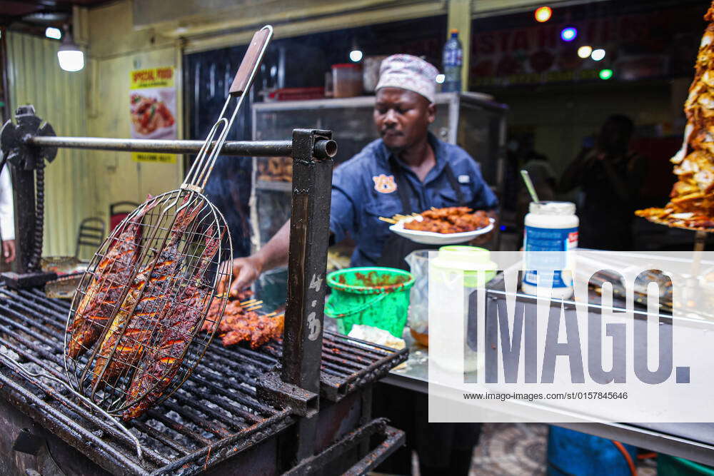 May 2, 2022, Nairobi, Kenya Kenyan chef picks meat skewers from the